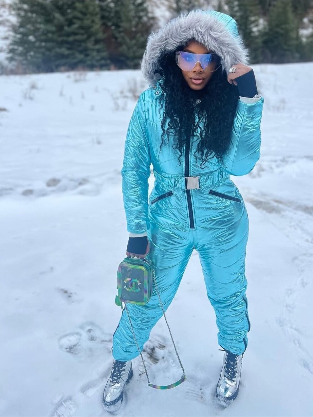 Metallic Blue Jumpsuit with Faux Fur Trim 80% Cotton 20% Polyester .